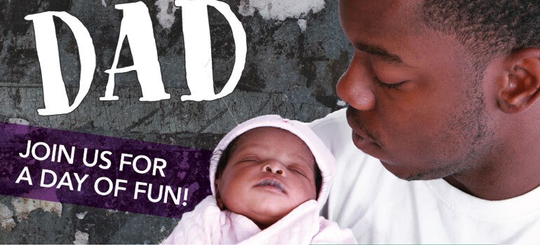 Dad holding infant daughter